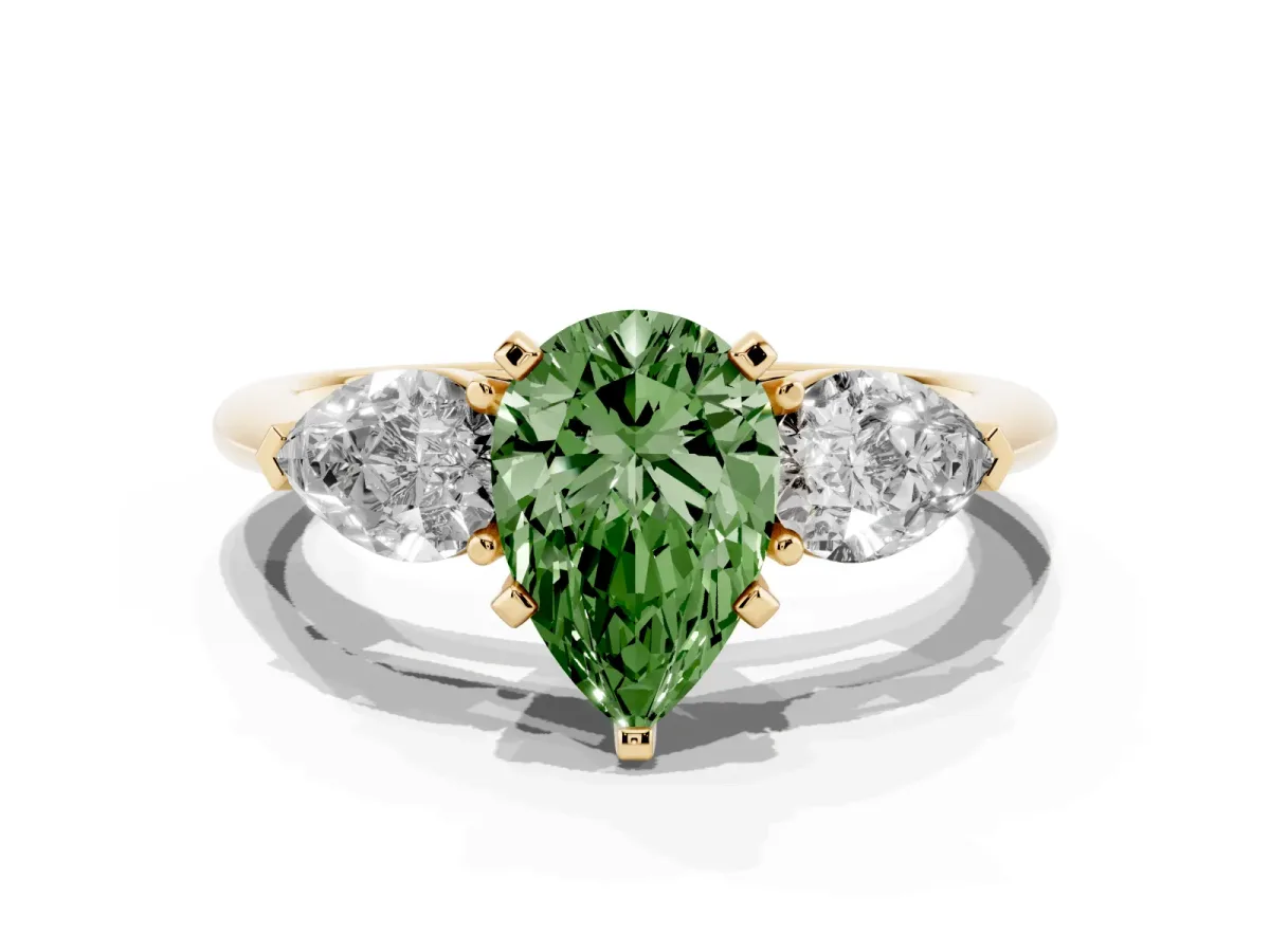 Fancy Green Three-Stone Pear Cut Diamond Ring with Pear Side Stones and Four-Prong Setting Yellow gold