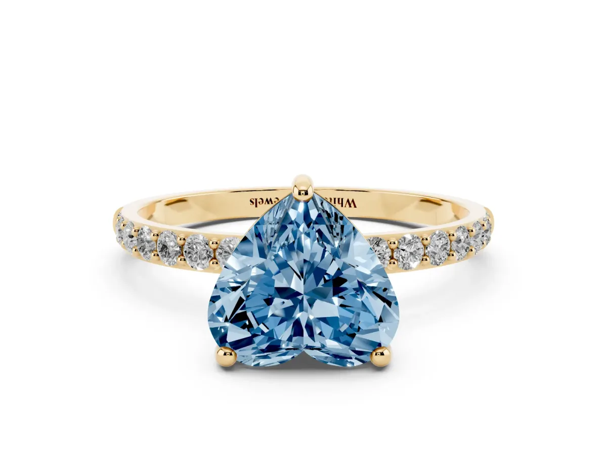 Fancy Blue Heart Cut Diamond Solitaire Ring with Round Pavé Band and Prong Setting Yellow gold