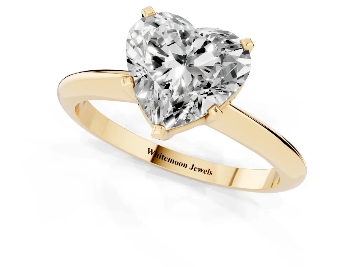 Heart Cut Cut Solitaire Ring with Four-Prong Setting on a Classic Band Yellow gold