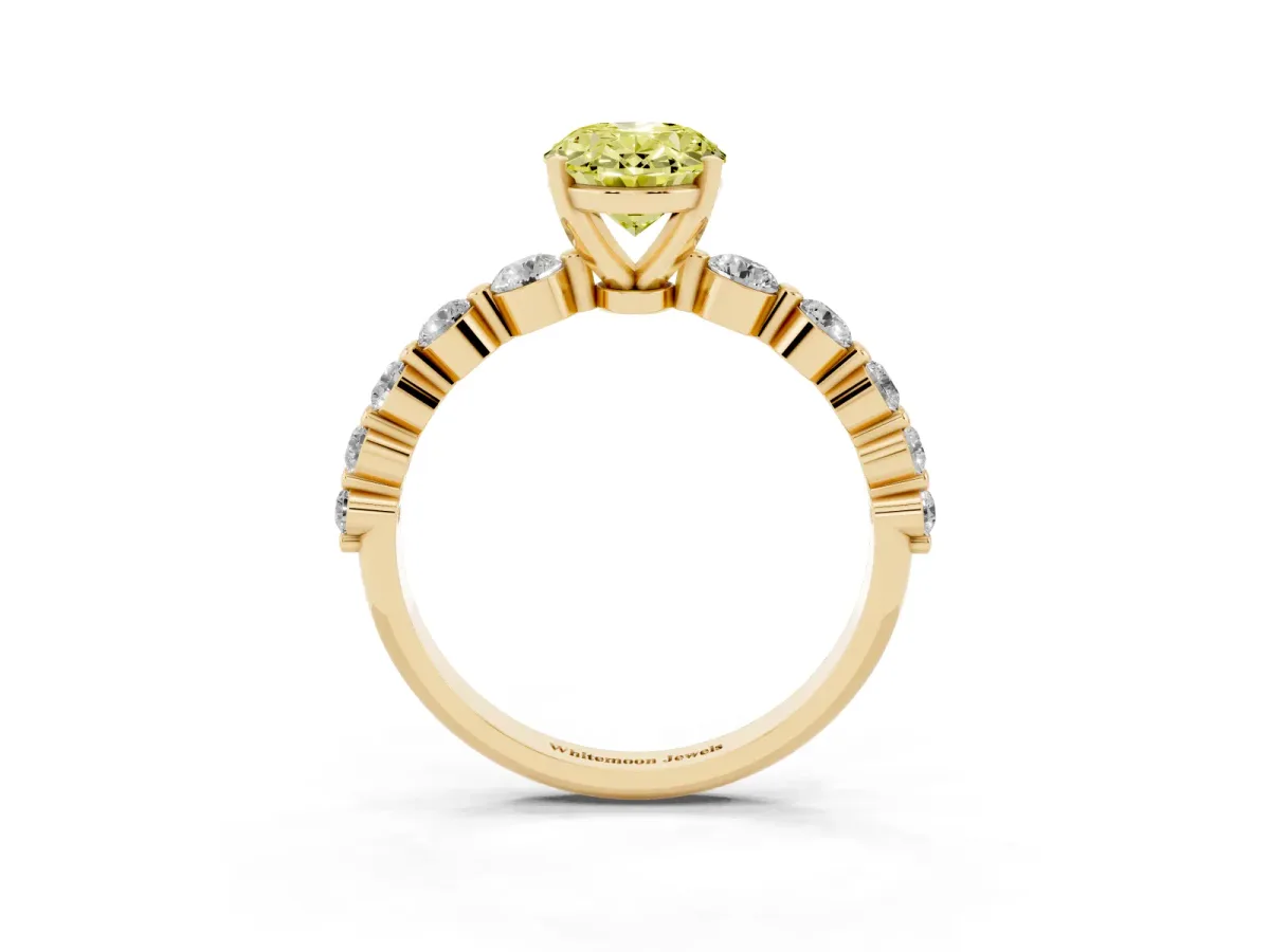 Fancy Yellow Oval Cut Solitaire Diamond Ring with Pave Band and Four-Prong Setting Yellow gold