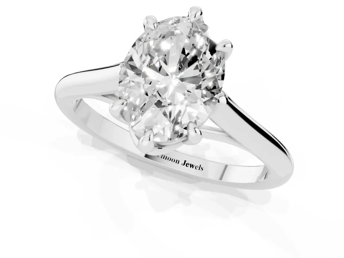 Oval Cut Solitaire Engagement Ring with Six-Prong Setting and Classic Band Silver