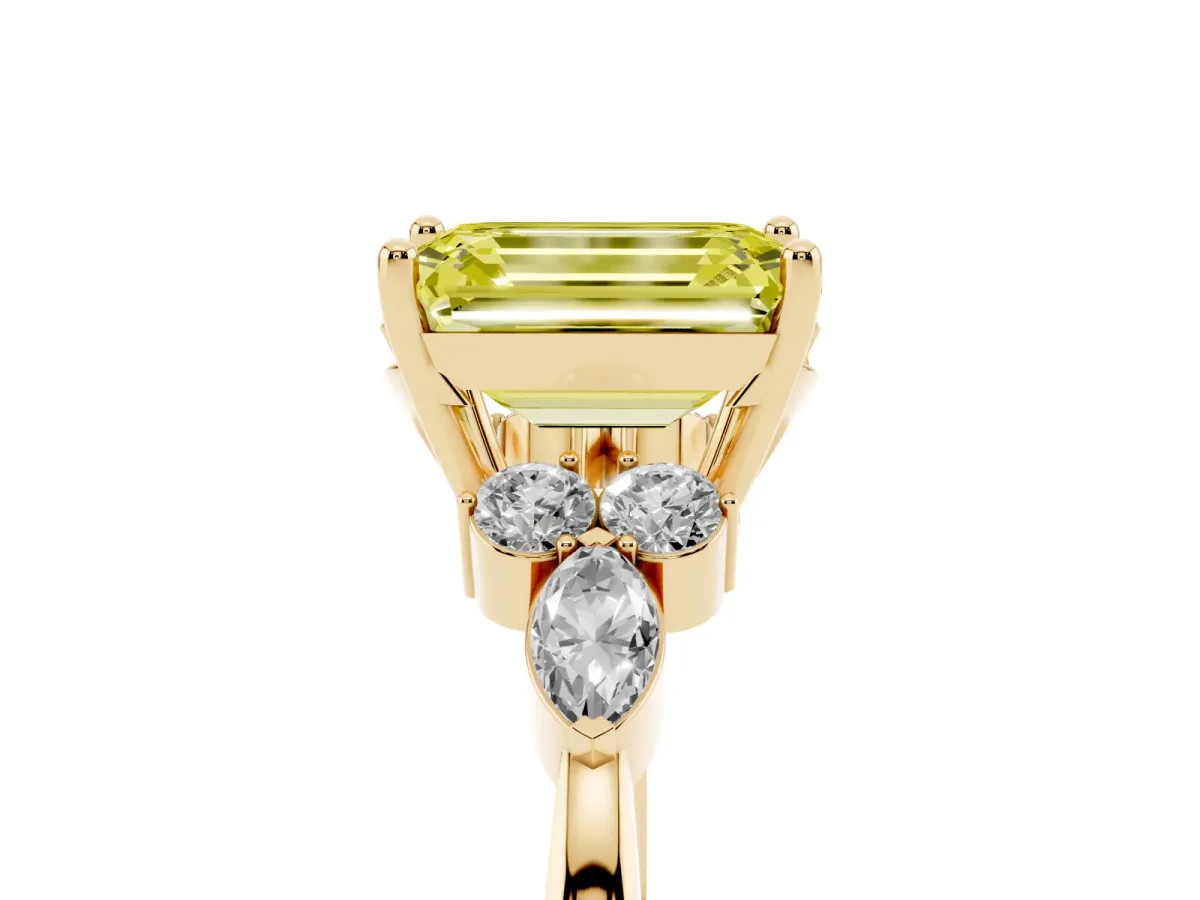 Fancy Yellow Emerald Cut Brilliant Diamond Solitaire Ring with Pear Side Stones and Four-Prong Setting Yellow gold