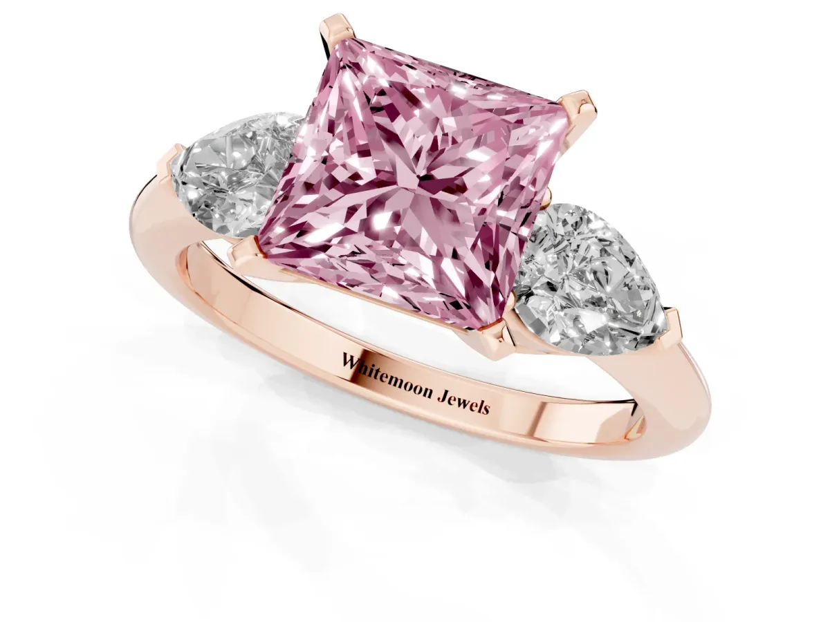 Fancy Pink Three-Stone Princess Cut Diamond Ring with Pear Side Stones and Four-Prong Setting Rose gold