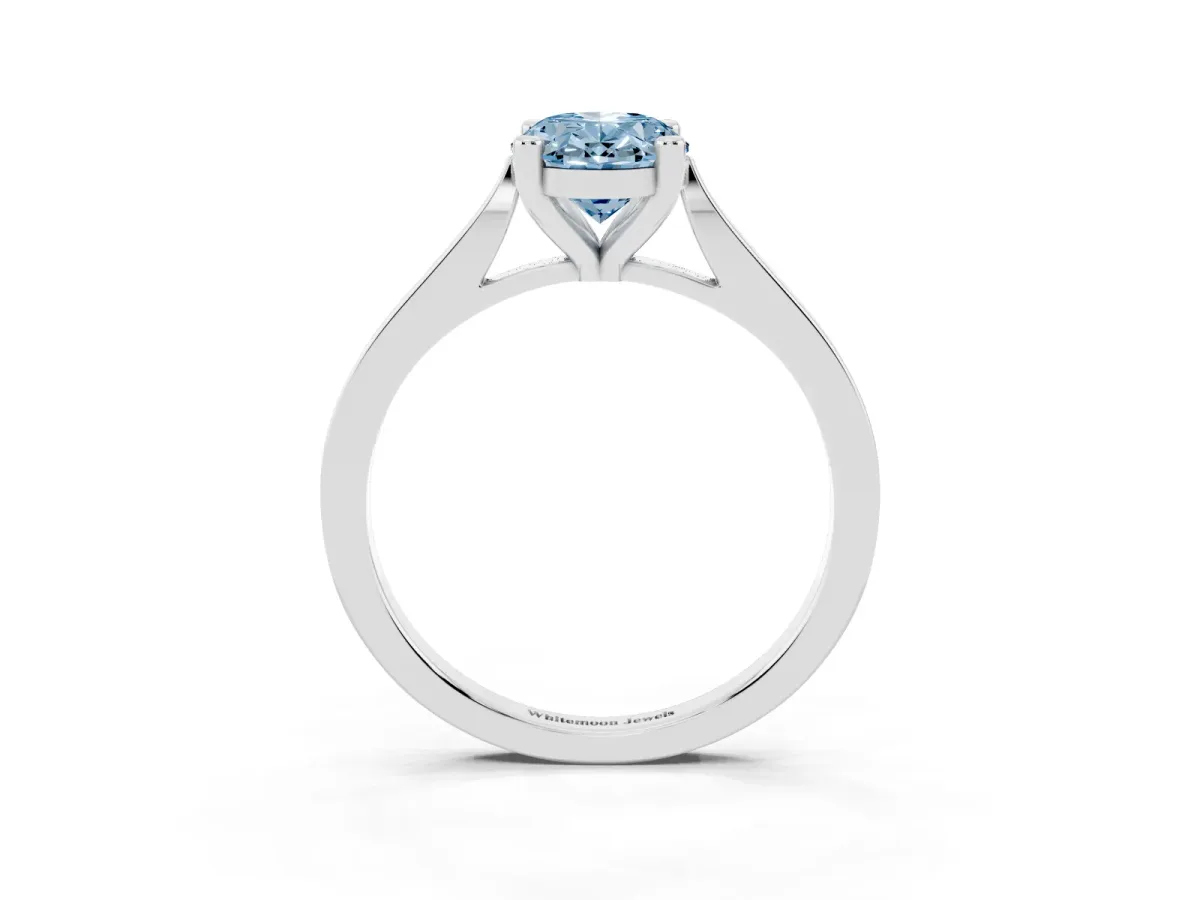 Fancy Blue Oval Cut Solitaire Diamond Ring with Four-Prong Setting and Tapered Band Platinum