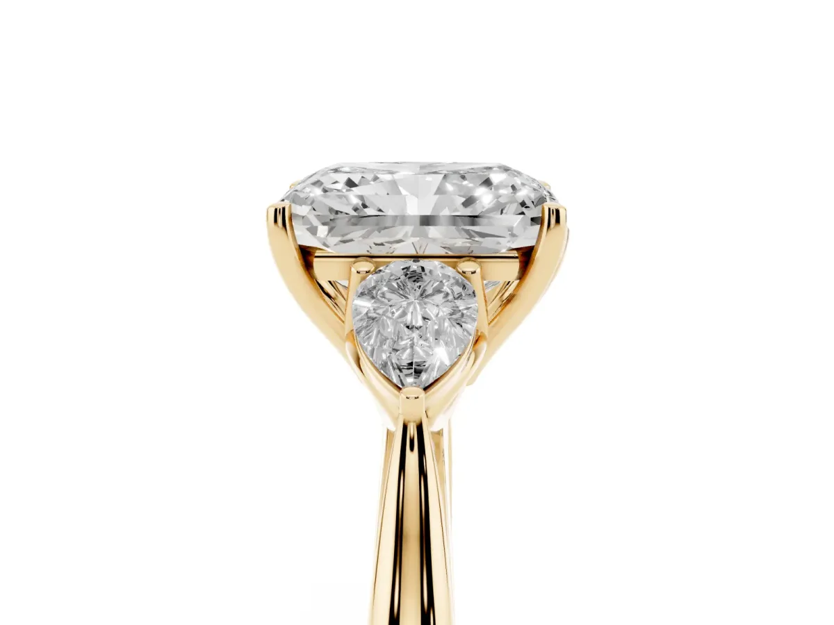 Three-Stone Radiant Cut Brilliant Diamond Solitaire Ring with Tapered Band and Four-Prong Setting Yellow gold