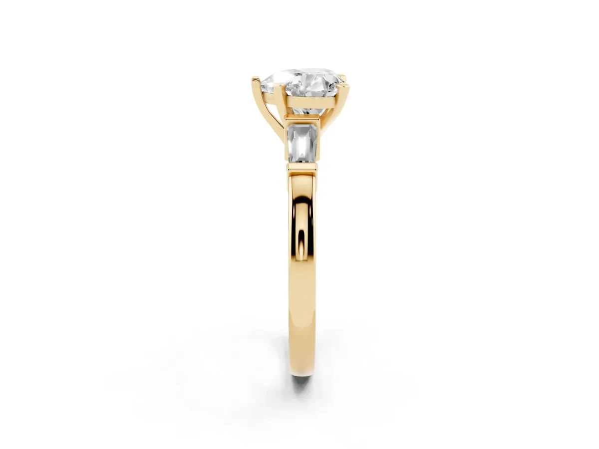 Heart Cut Cut Diamond Solitaire Ring with Tapered Baguette Accents and Four-Prong Setting Yellow gold