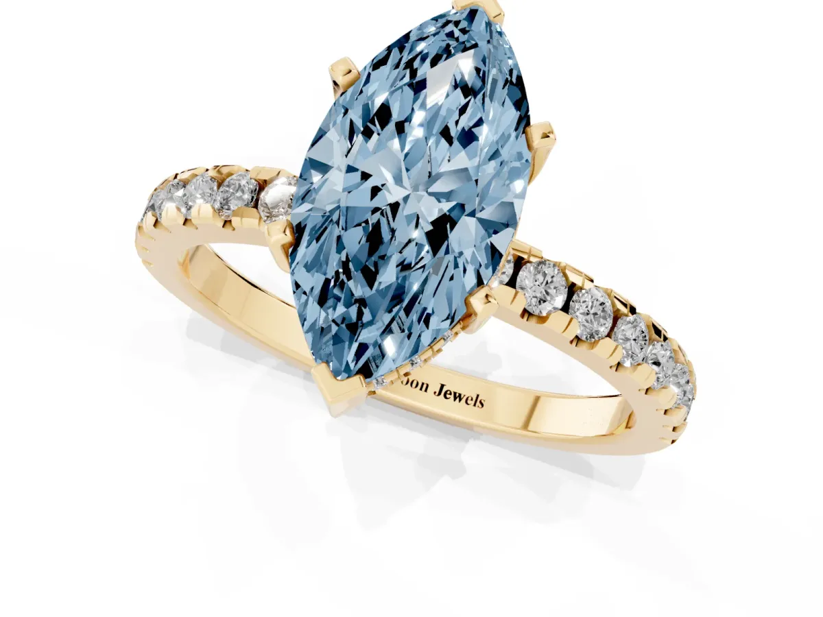 Fancy Blue Marquise Cut Diamond Solitaire Ring with Round Pavé Band and Four-Prong Setting Yellow gold