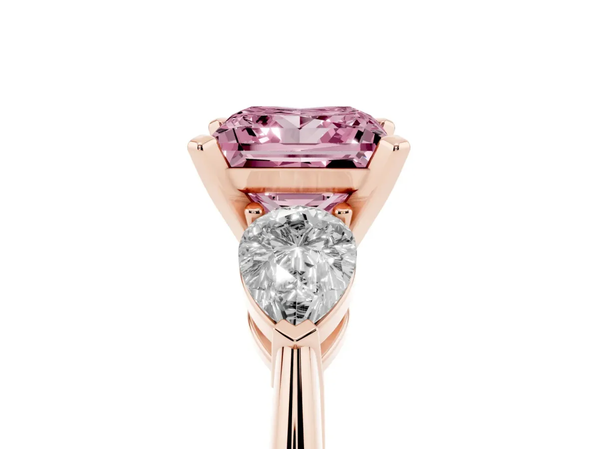 Fancy Pink Three-Stone Princess Cut Diamond Ring with Pear Side Stones and Four-Prong Setting Rose gold