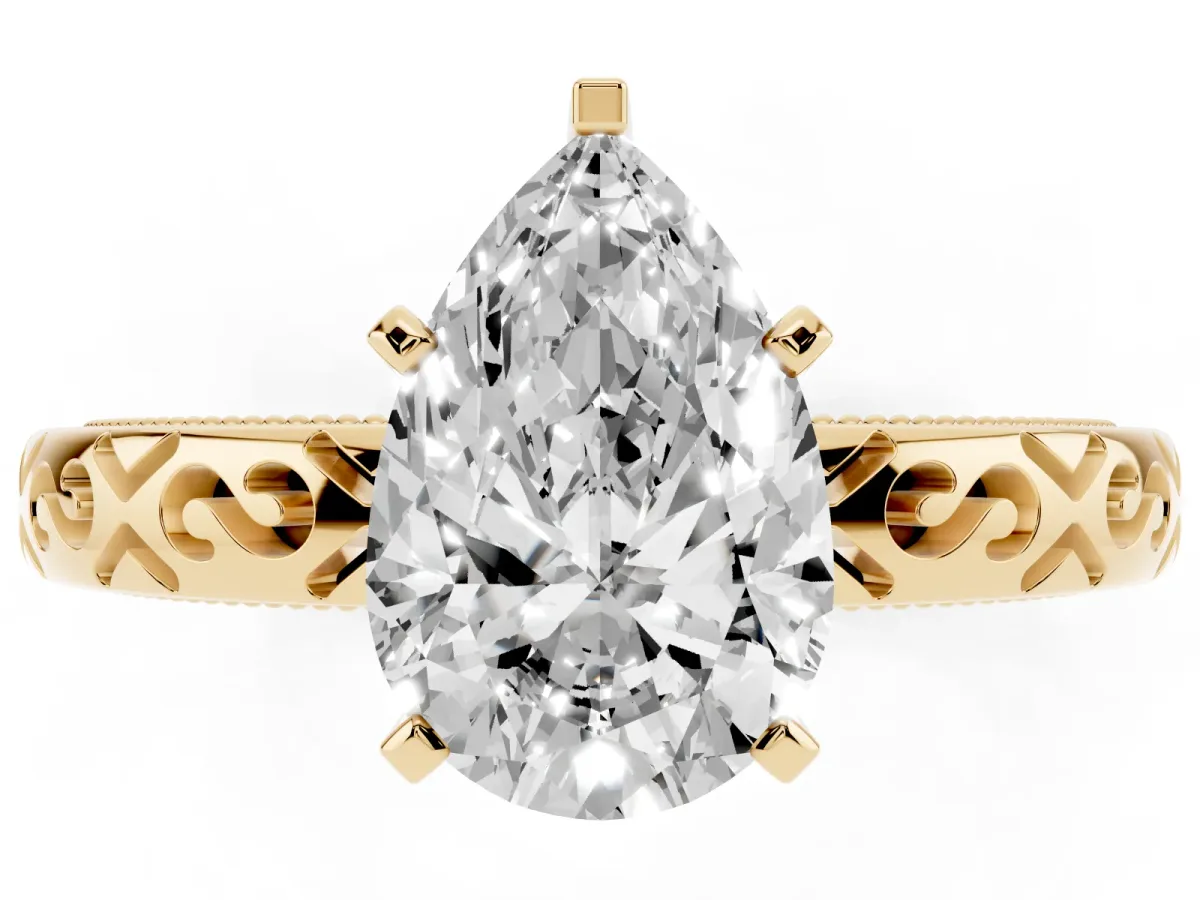Pear Cut Solitaire Engagement Ring with Scrollwork Band and Four-Prong Setting Yellow gold