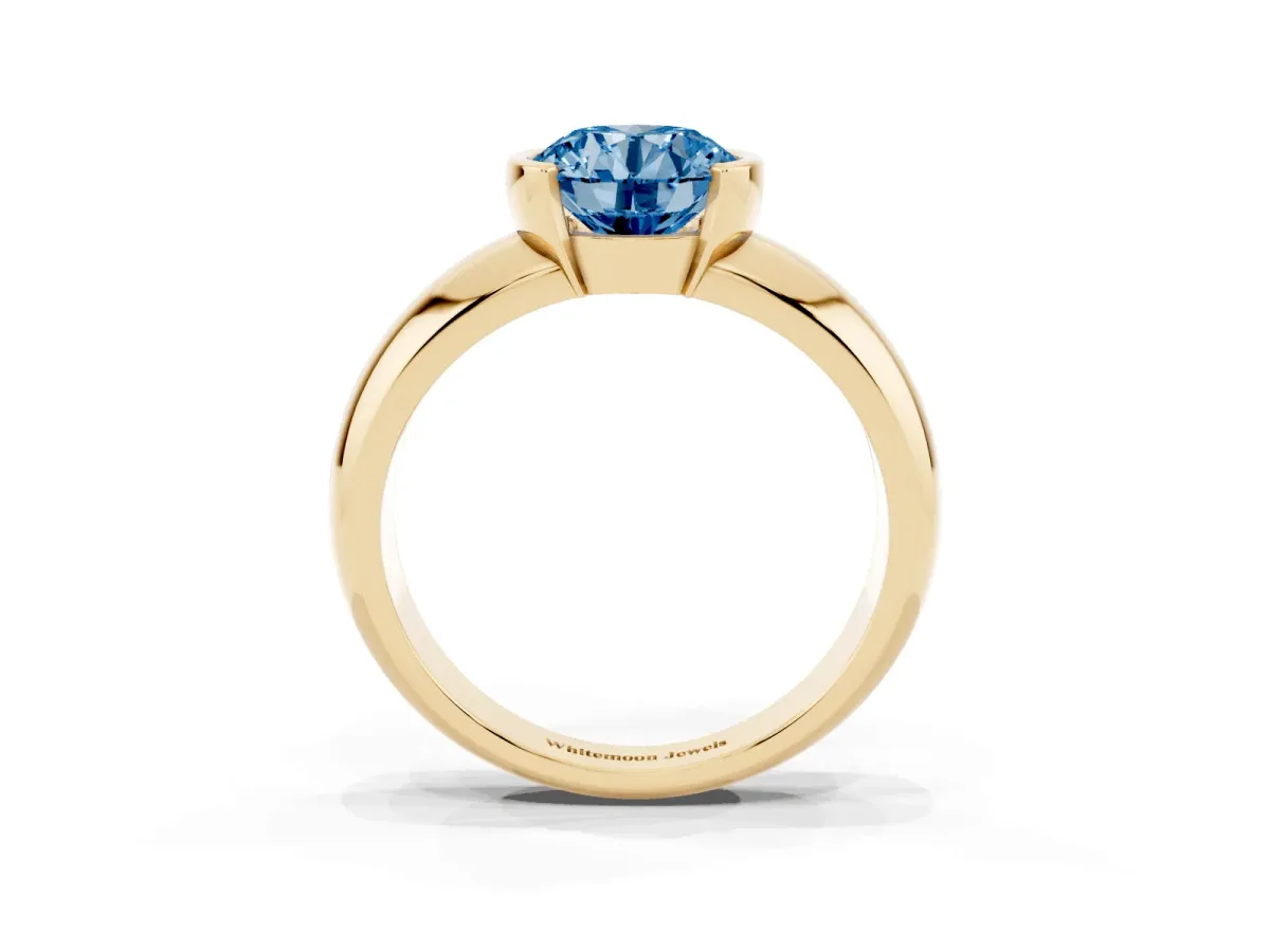 Fancy Blue Round Cut Solitaire Tension Set Diamond Ring with Wide Band Yellow gold