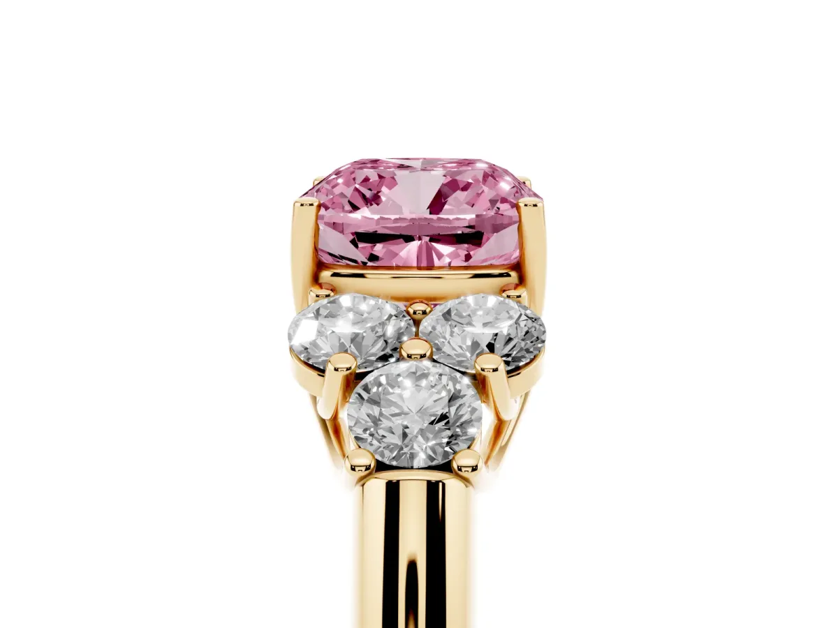 Fancy Pink Cushion Cut Cut Diamond Cluster Ring with Round Accent Stones and Prong Setting on a Classic Band Yellow gold