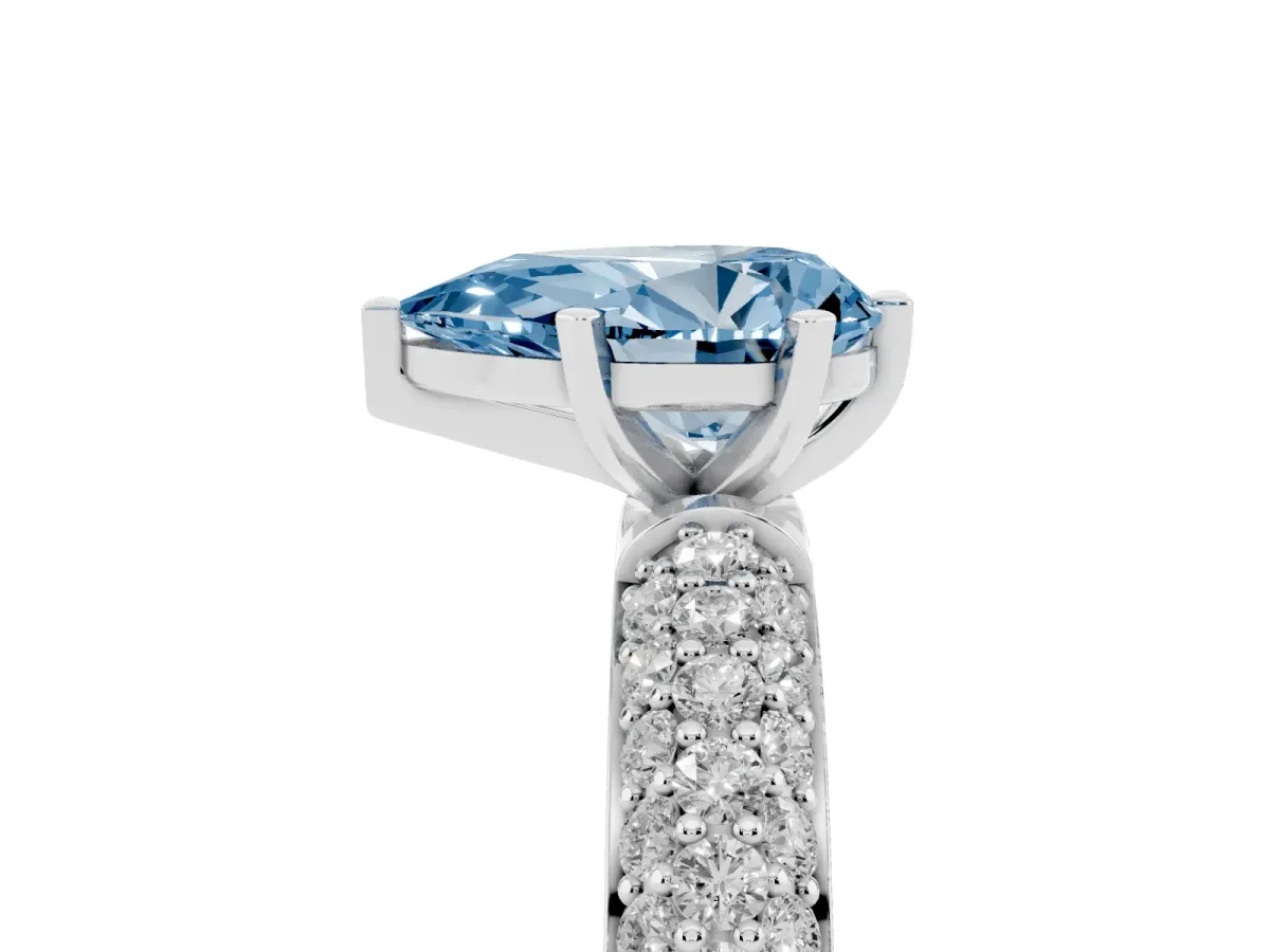 Fancy Blue Pear Cut Diamond Solitaire Ring with Prong Setting and Pavé Band Silver