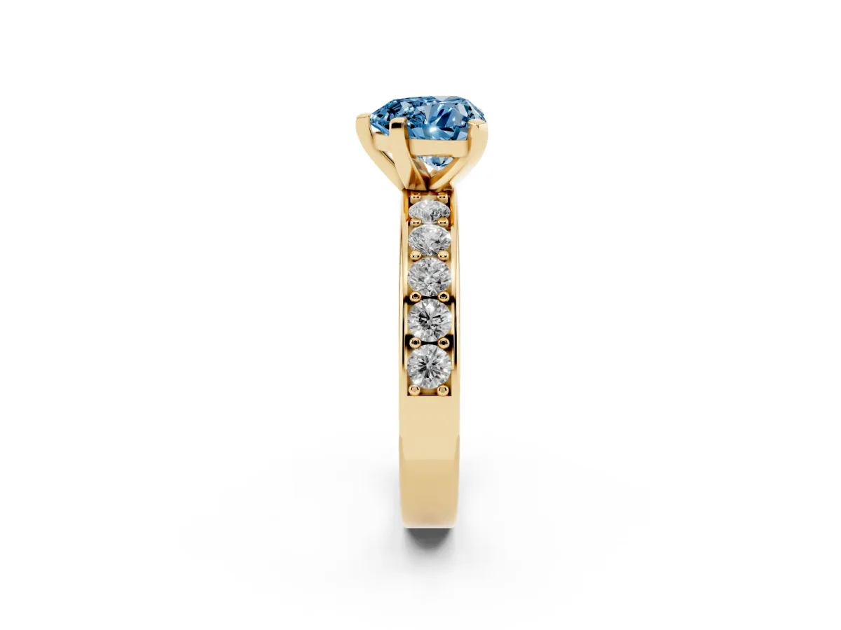 Fancy Blue Heart Cut Diamond Engagement Ring with Channel Set Round Band and Prong Setting Yellow gold