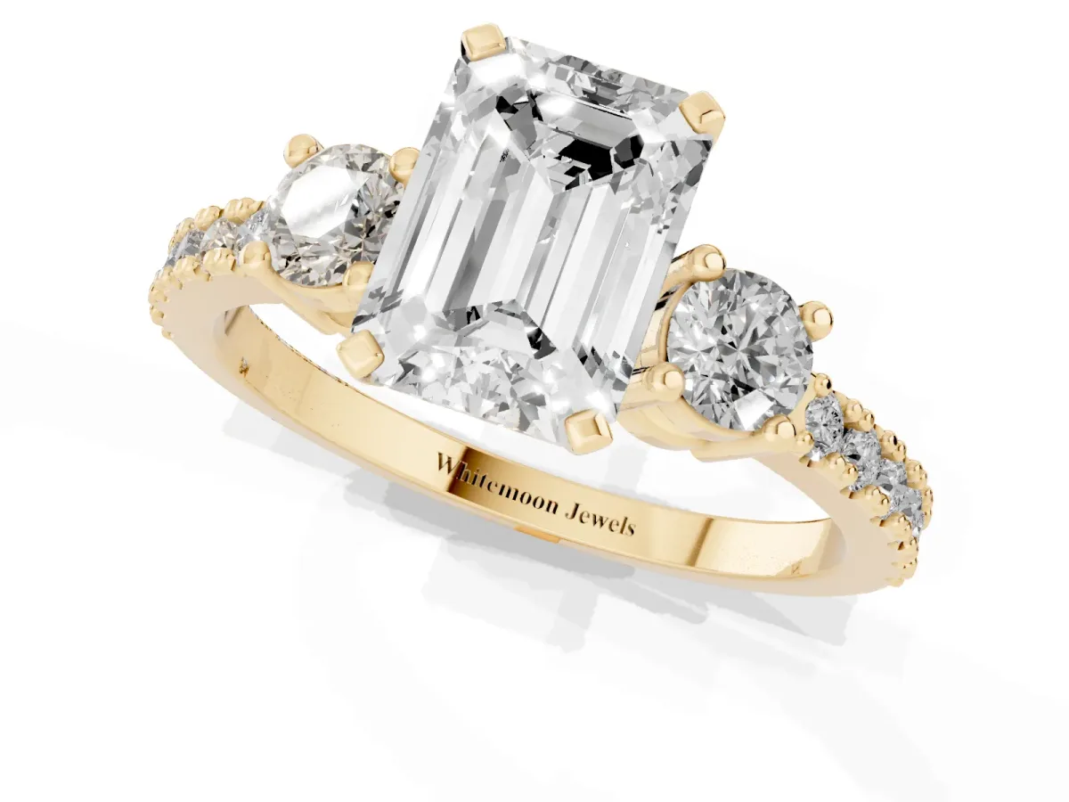 Emerald Cut Three-Stone Diamond Pavé Band with Prong Setting Yellow gold