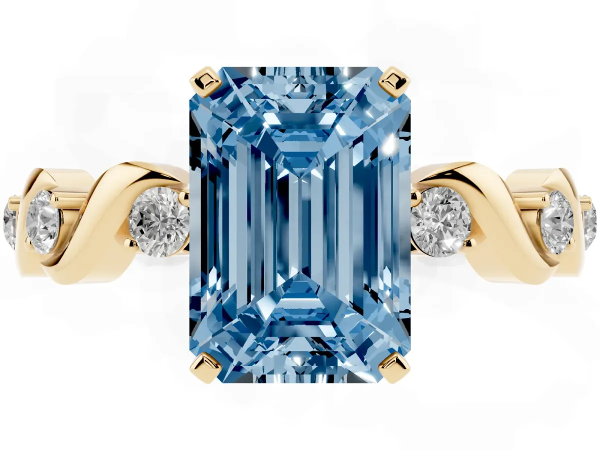 Fancy Blue Emerald Cut Diamond Solitaire Twisted Band with Round Accents and Prong Setting Yellow gold