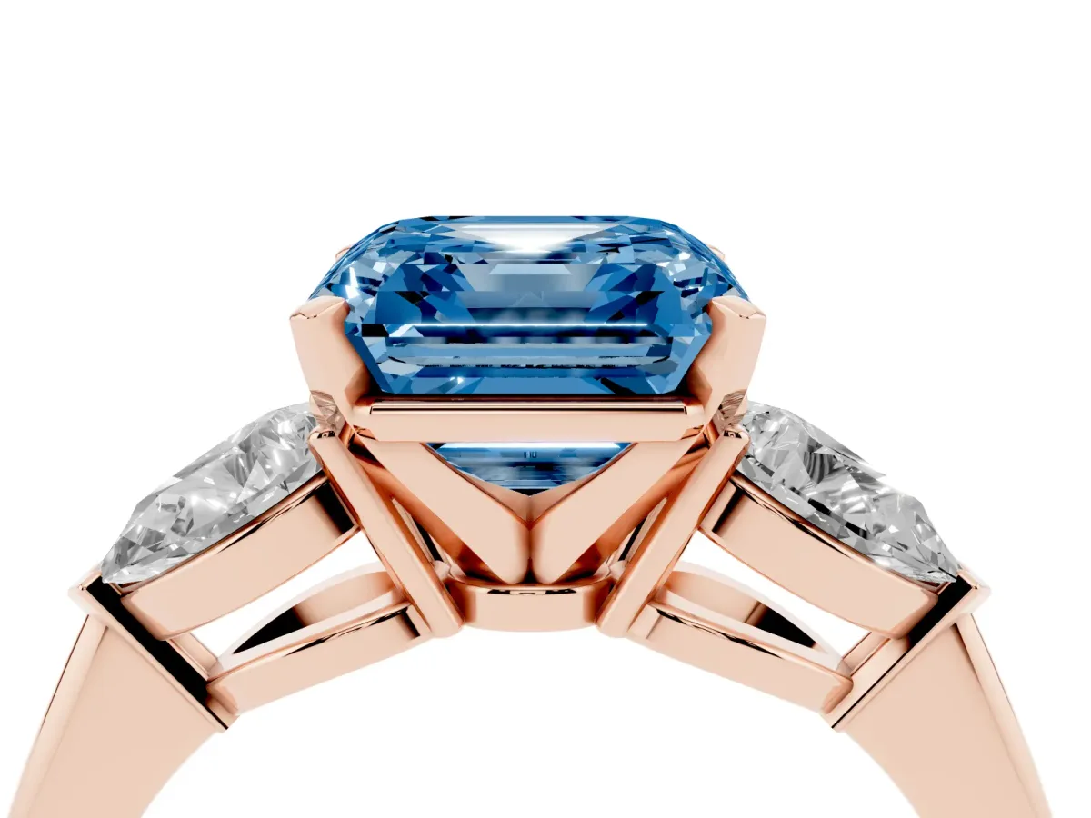 Fancy Blue Three-Stone Asscher Cut Diamond Ring with Pear Side Stones and Four-Prong Setting Rose gold