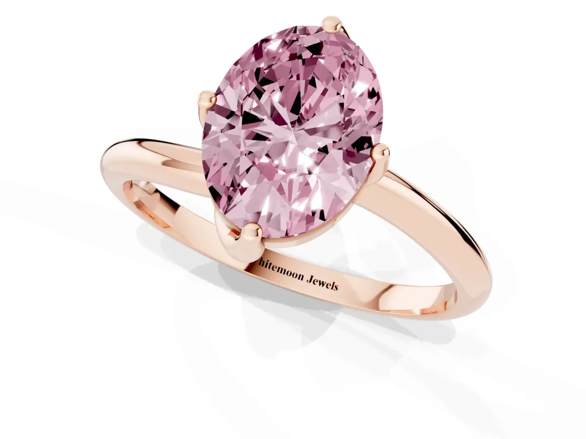 Fancy Pink Oval Cut Diamond Solitaire Engagement Ring with Four-Prong Setting and Classic Band Rose gold