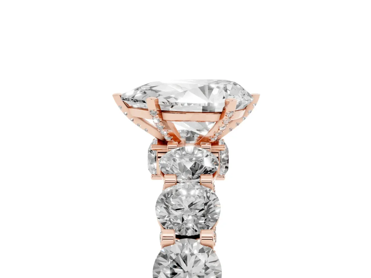 Pear Cut Diamond Side Stone Engagement Ring with Four-Prong Setting Rose gold
