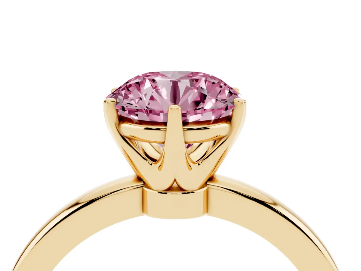Fancy Pink Round Cut Solitaire Diamond Ring with Six-Prong Setting on a Classic Band Yellow gold