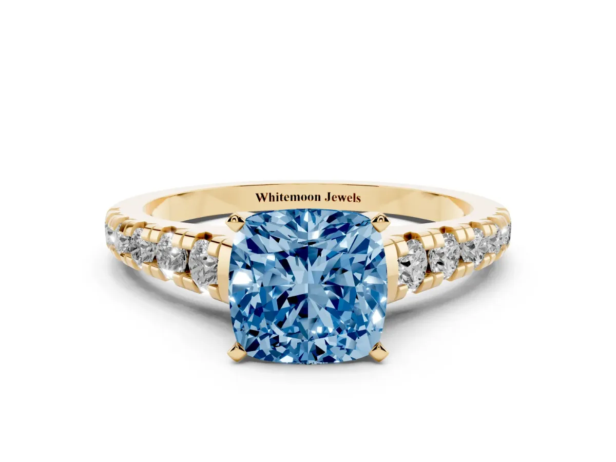 Fancy Blue Cushion Cut Diamond Cathedral Solitaire Ring with Round Pavé Band Yellow gold