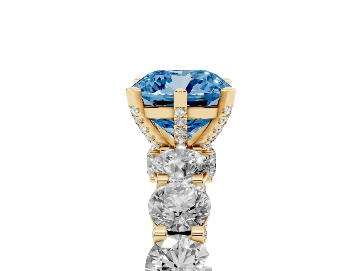 Fancy Blue Cushion Cut Diamond Side Stone Engagement Ring with Four-Prong Setting Yellow gold