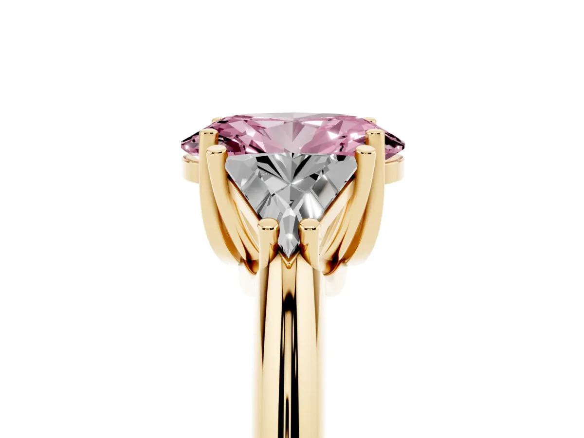 Fancy Pink Three-Stone Oval Cut Diamond Engagement Ring with Trillion Side Stones and Prong Setting Yellow gold