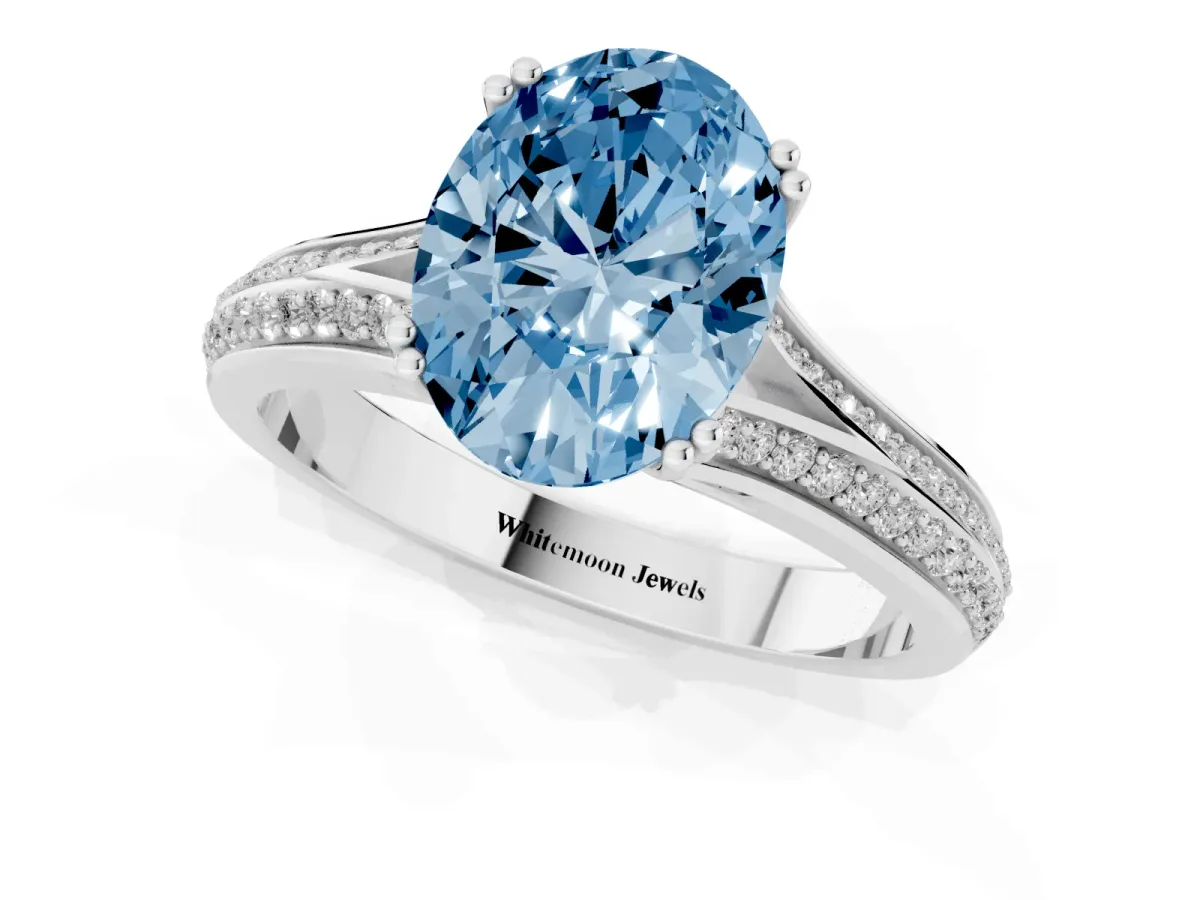 Fancy Blue Oval Cut Diamond Split Shank Engagement Ring with Pavé Band White gold