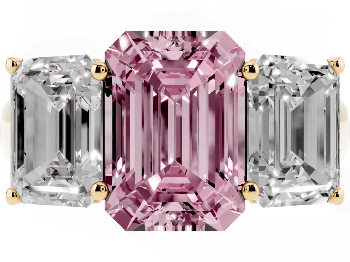 Fancy Pink Emerald Cut Three-Stone Diamond Ring with Prong Setting on a Classic Band Yellow gold