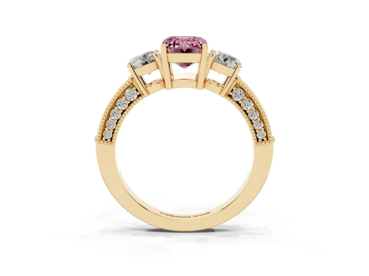 Fancy Pink Emerald Cut Three-Stone Diamond Ring with Pavé Band and Four-Prong Setting Yellow gold