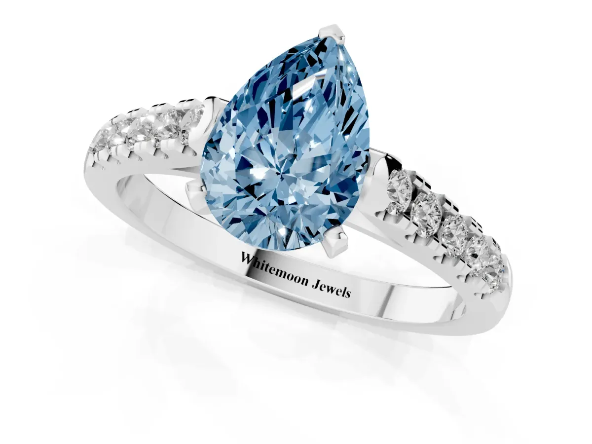 Fancy Blue Pear Cut Diamond Pavé Band Solitaire Ring with Prong Setting Platinum
