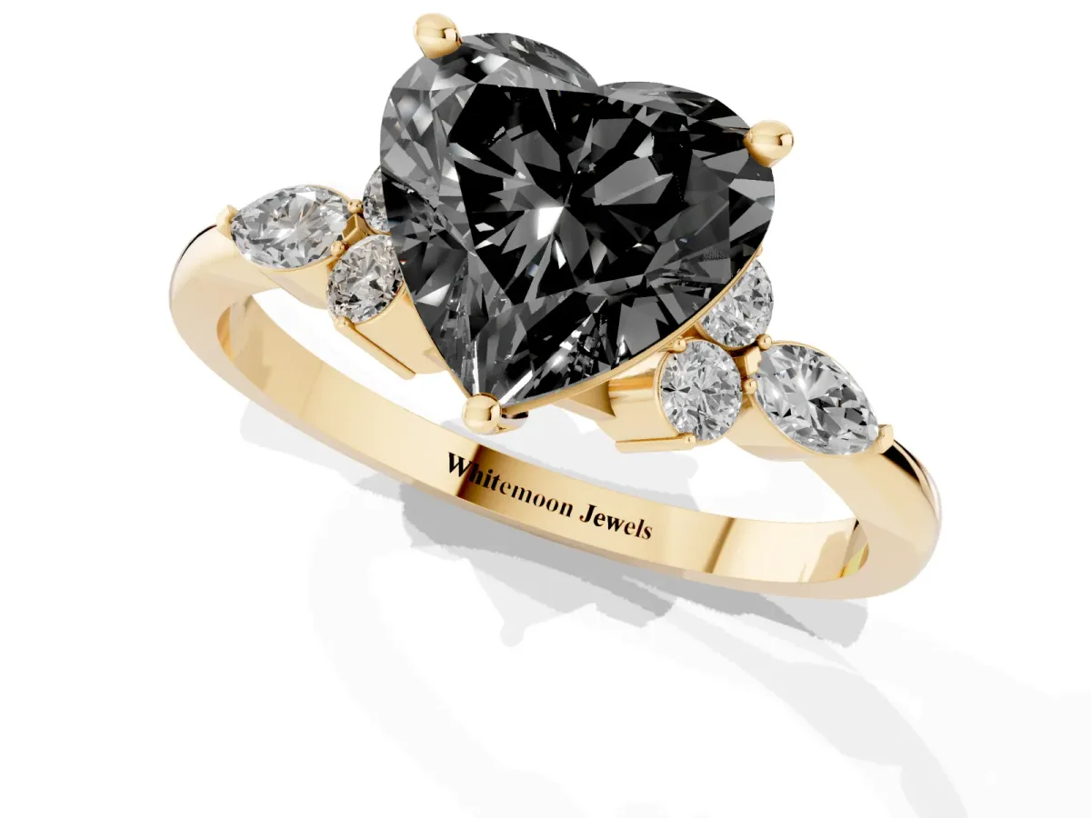 Fancy Black Heart Cut Brilliant Diamond Solitaire Ring with Pear Side Stones and Four-Prong Setting Yellow gold
