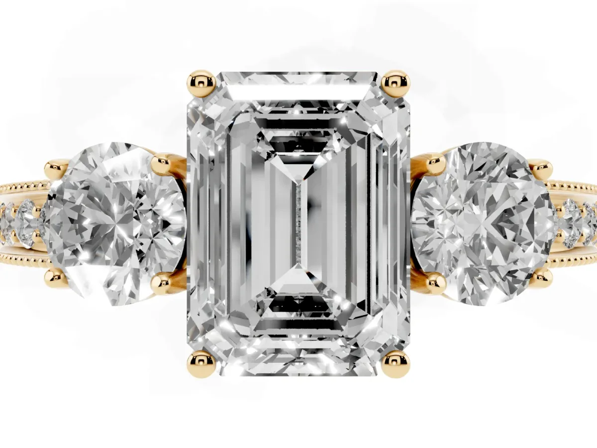 Emerald Cut Three-Stone Diamond Ring with Pavé Band and Four-Prong Setting Yellow gold