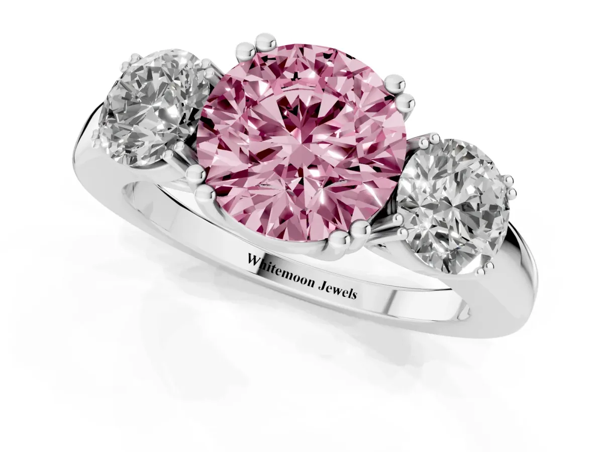 Fancy Pink Three-Stone Round Cut Cut Diamond Ring with Channel Set Band and Four-Prong Setting Silver