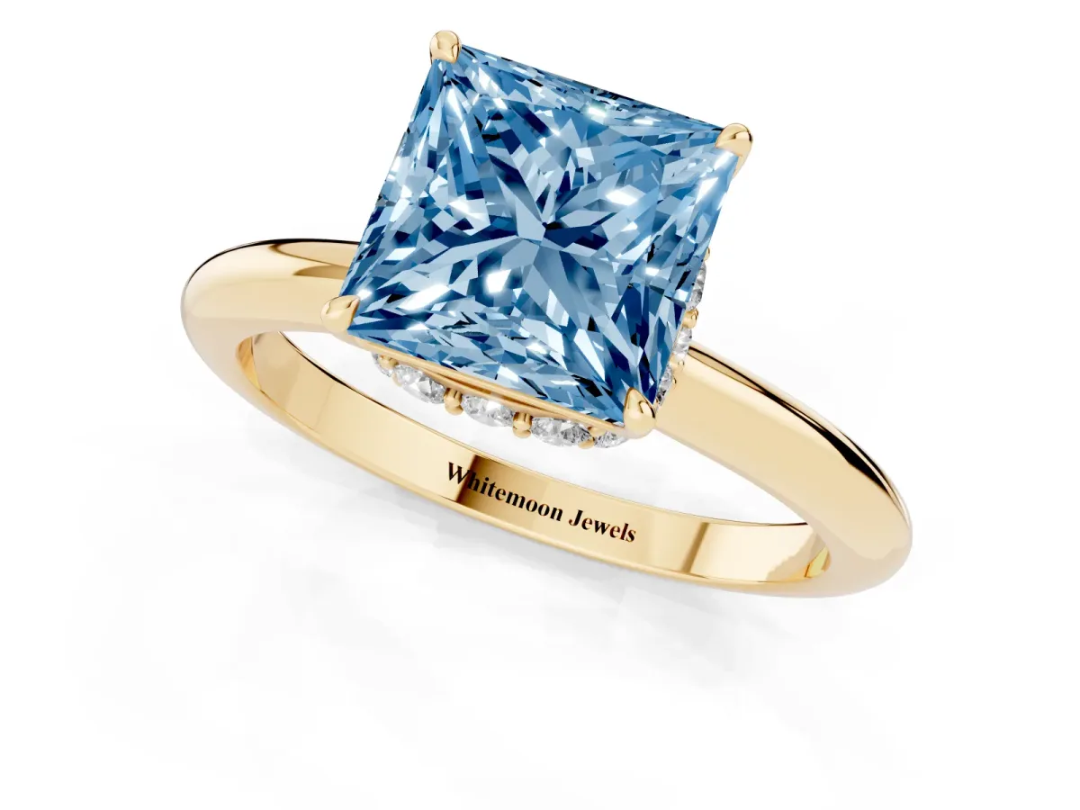 Fancy Blue Princess Cut Brilliant Solitaire Engagement Ring with Six-Prong Setting and Classic Band Yellow gold