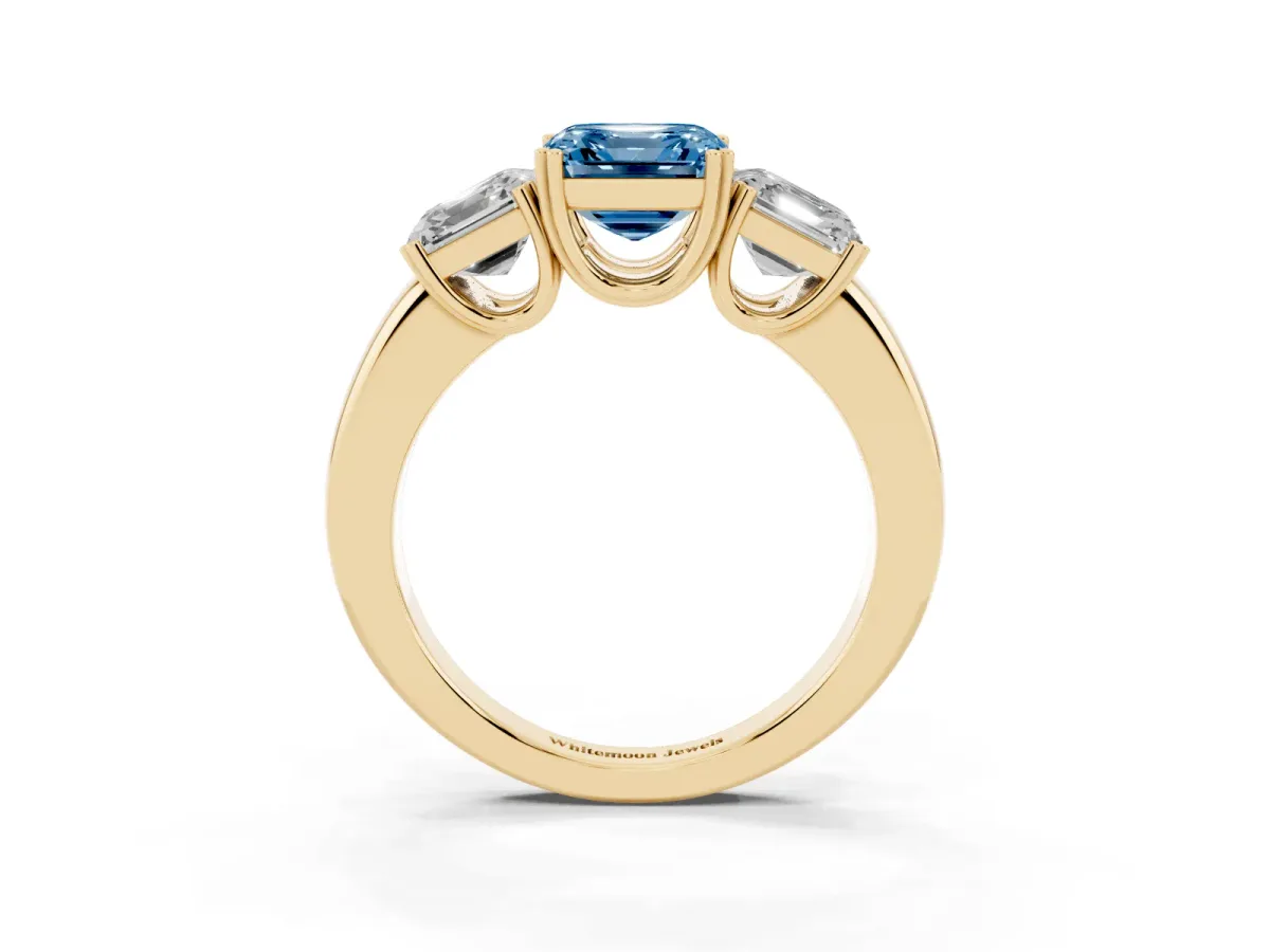 Fancy Blue Three-Stone Asscher Cut Cut Diamond Ring with Channel Set Band and Four-Prong Setting Yellow gold