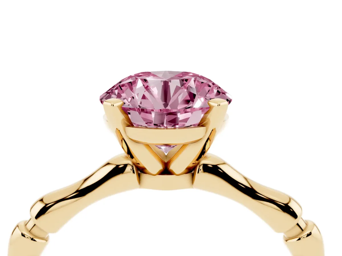 Fancy Pink Round Cut Solitaire Diamond Ring with Bamboo Band and Four-Prong Setting Yellow gold