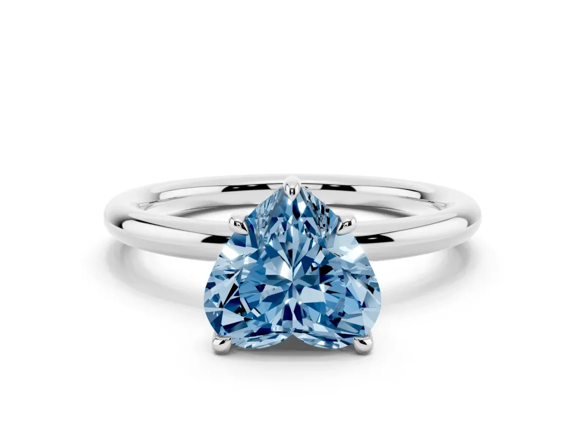 Fancy Blue Heart Cut Diamond Solitaire Ring with Thin Band and Four-Prong Setting Silver