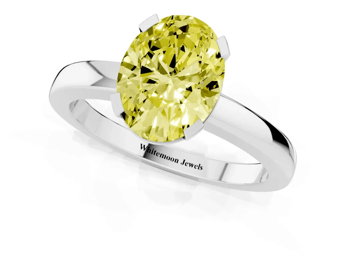 Fancy Yellow Oval Cut Cut Solitaire Ring with Four-Prong Setting and Classic Band Silver