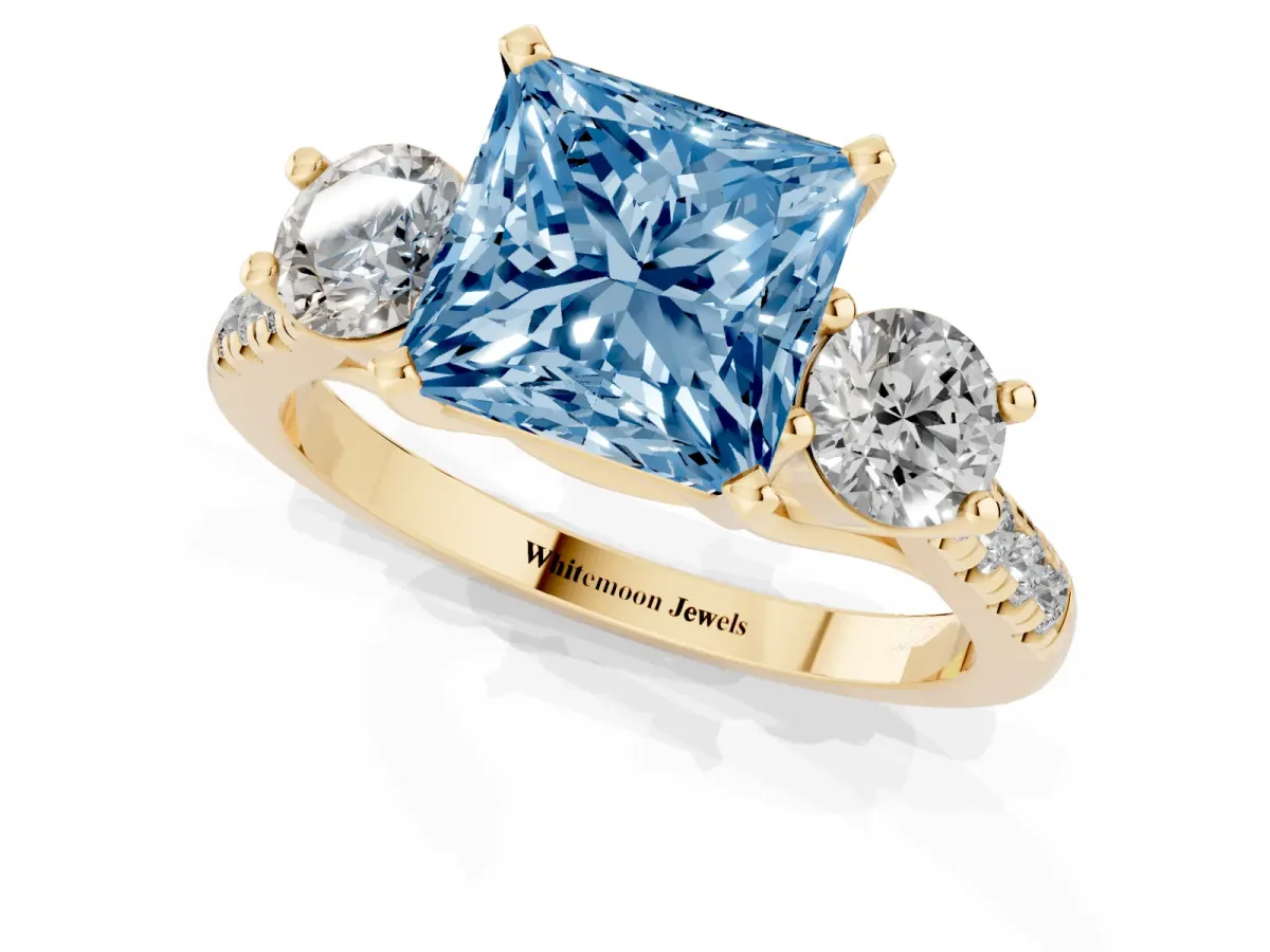 Fancy Blue Three-Stone Princess Cut Diamond Pavé Band with Four-Prong Setting Yellow gold