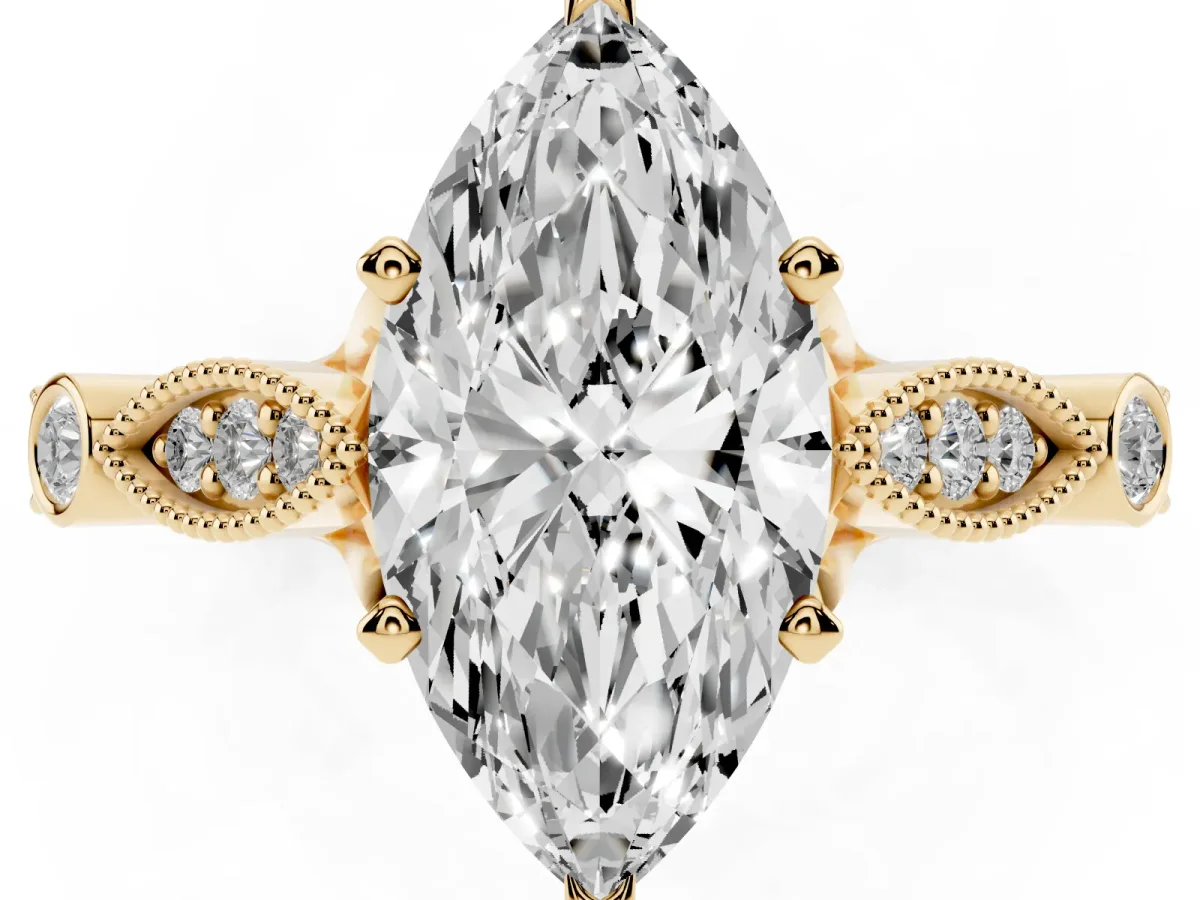 Marquise Cut Cut Diamond with Milgrain Marquise and Bezel Accents on a Solitaire Band with Prong Setting Yellow gold