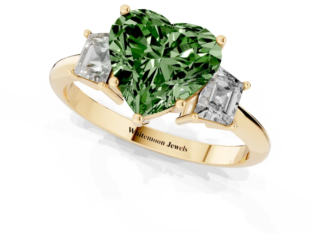 Fancy Green Heart Cut Diamond Three-Stone Ring with Trapezoid Side Stones and Prong Setting Yellow gold
