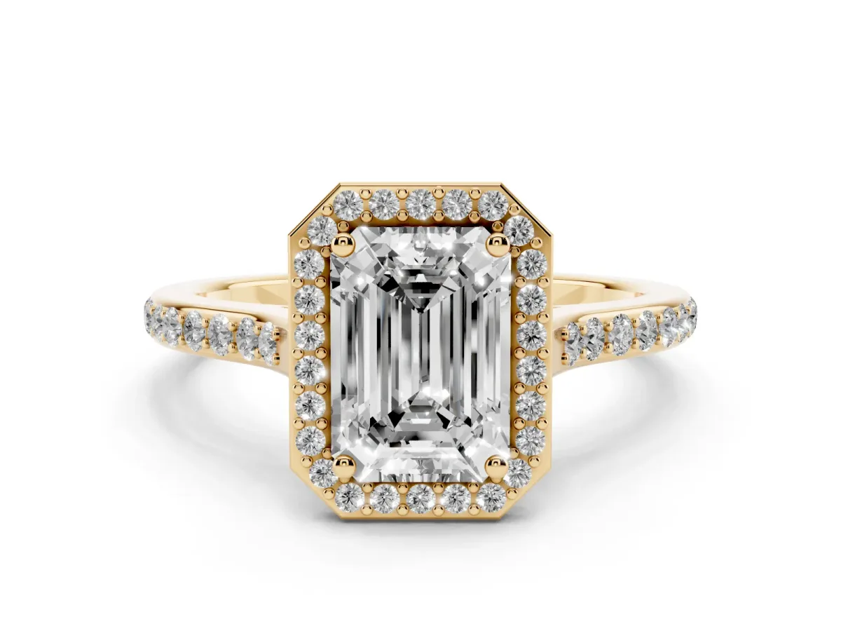 Emerald Cut Diamond Halo Engagement Ring with Round Pavé Shoulders and Prong Setting Yellow gold