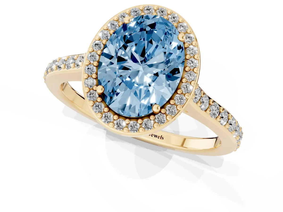 Fancy Blue Oval Cut Diamond Halo Engagement Ring with Round Pavé Shoulders and Prong Setting Yellow gold