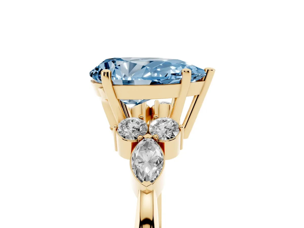 Fancy Blue Pear Cut Brilliant Diamond Solitaire Ring with Pear Side Stones and Four-Prong Setting Yellow gold