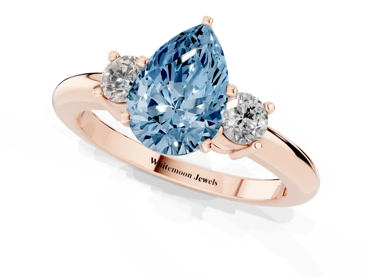 Fancy Blue Three-Stone Pear Cut Cut Diamond Solitaire with Prong Setting and Classic Band Rose gold