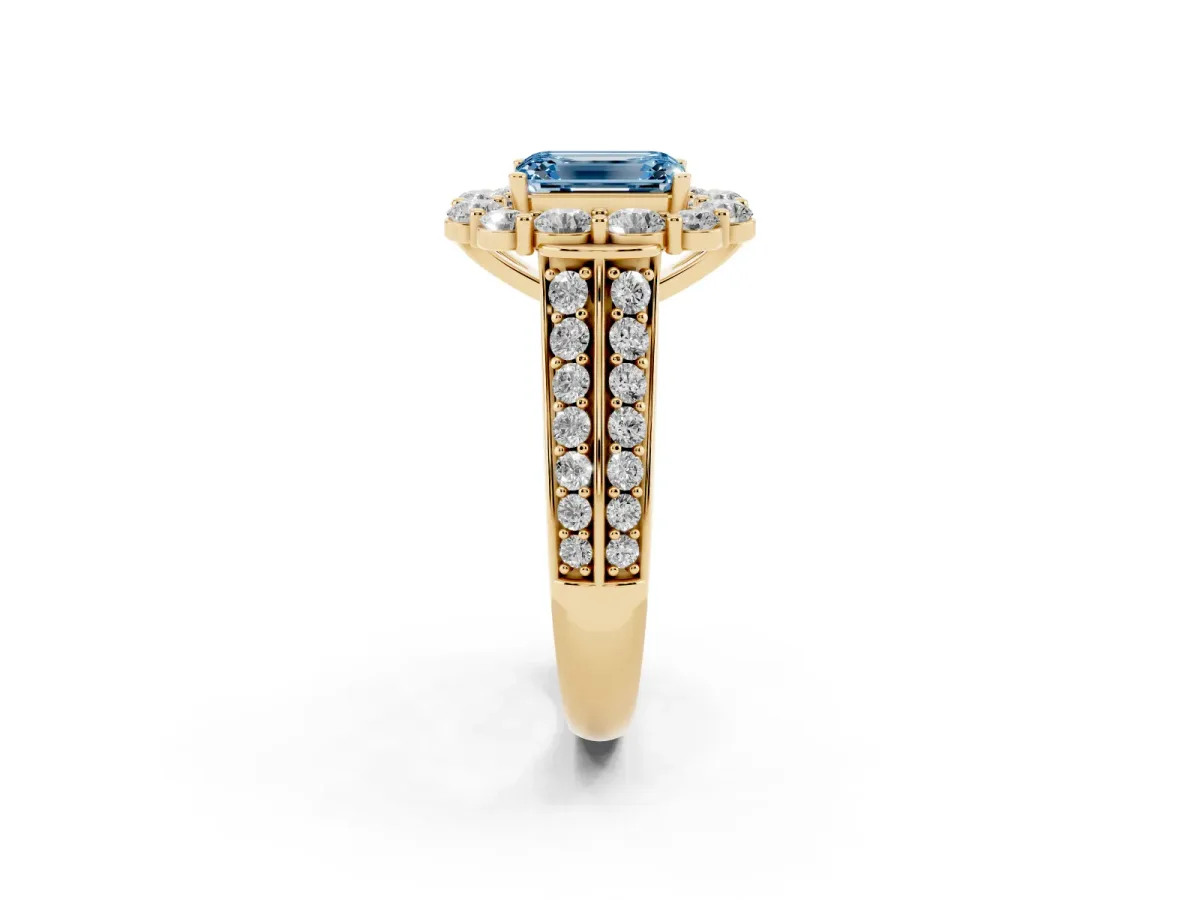 Fancy Blue Emerald Cut Halo Diamond Engagement Ring with Split Shank and Prong Setting Yellow gold