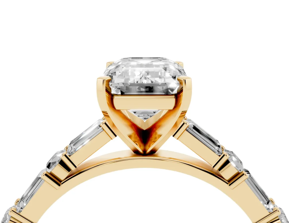 Emerald Cut Diamond Solitaire with Side Baguettes and Channel Set Band Yellow gold
