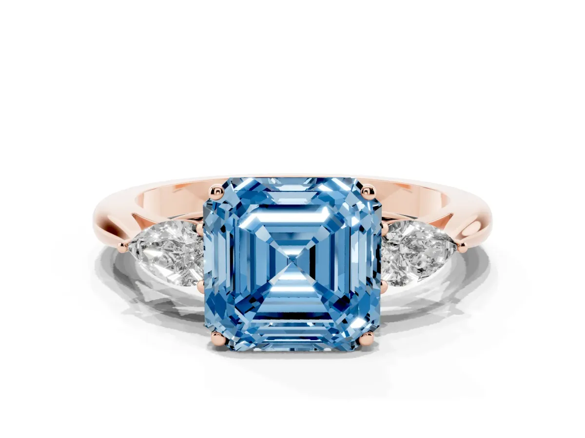 Fancy Blue Three-Stone Asscher Cut Brilliant Diamond Solitaire Ring with Tapered Band and Four-Prong Setting Rose gold
