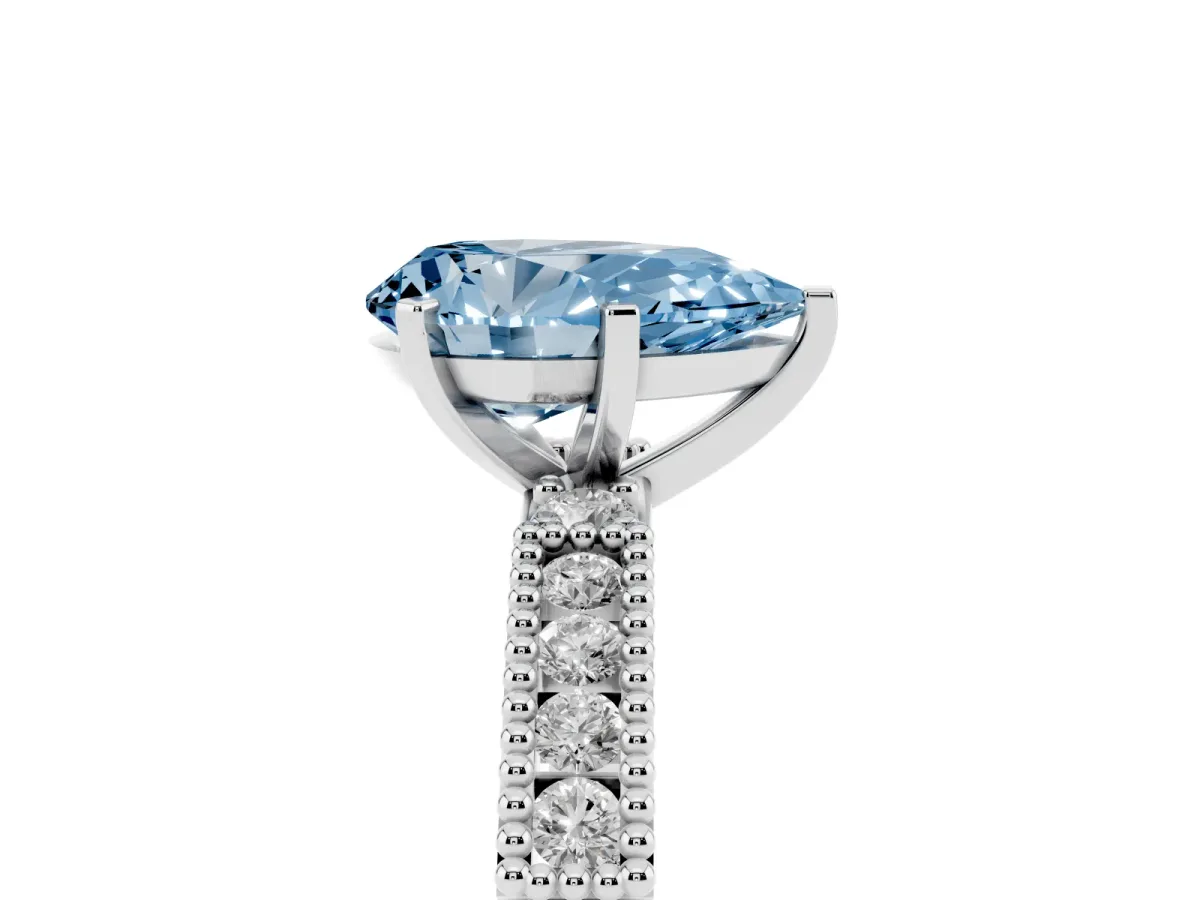 Fancy Blue Pear Cut Solitaire with Pavé Band and Four-Prong Setting Platinum