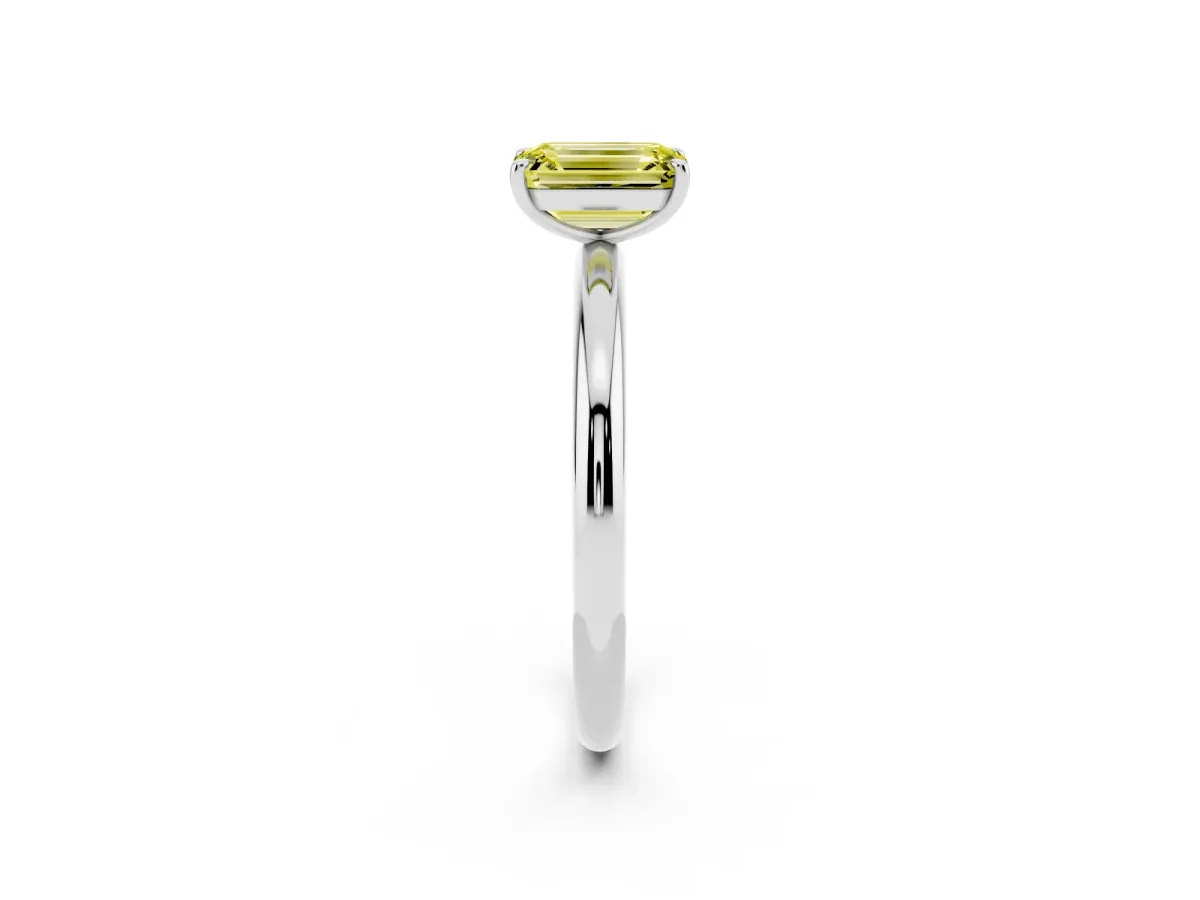 Fancy Yellow Emerald Cut Solitaire Diamond Ring with Four-Prong Setting on a Plain Band Platinum